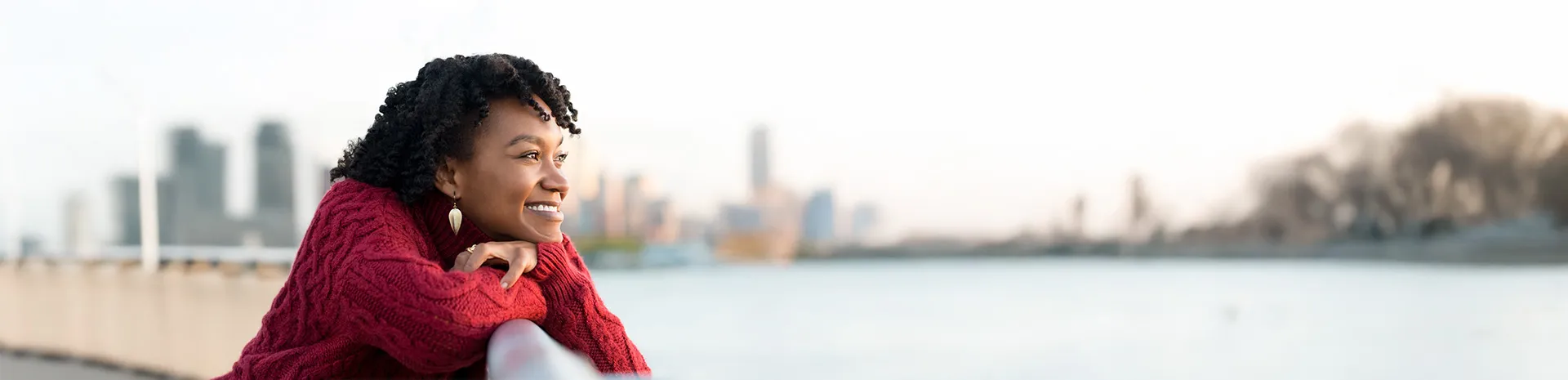 African American woman enjoying a peaceful scene by the water