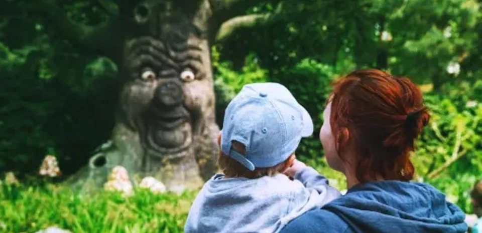 mother and child looking at mythical tree