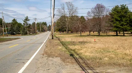 A parcel of land at 490 Main St. in Groton, seen here looking west near the intersection of Mill Street, is the proposed site of a new UMass Memorial Health emergency department. 