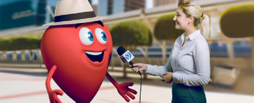 A female reporter holds a microphone to a cartoon-version of Bob's heart during an interview.